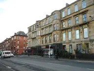 Blonde and red sandstone tenements with bay windows on Sauchiehall Street, Glasgow